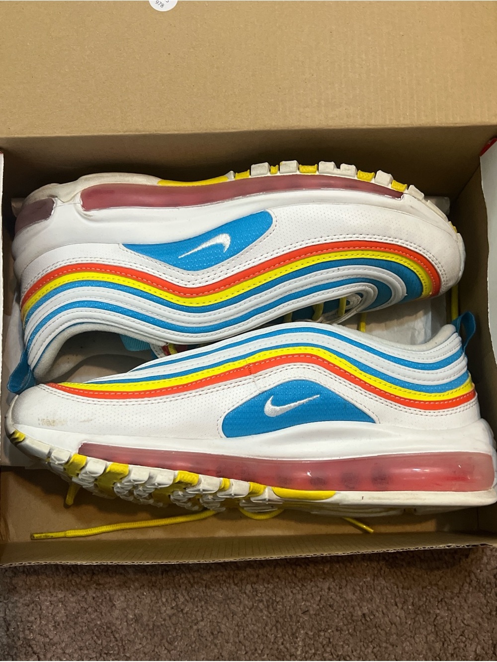 Nike Air Max 97 in blue, yellow, orange, and white
